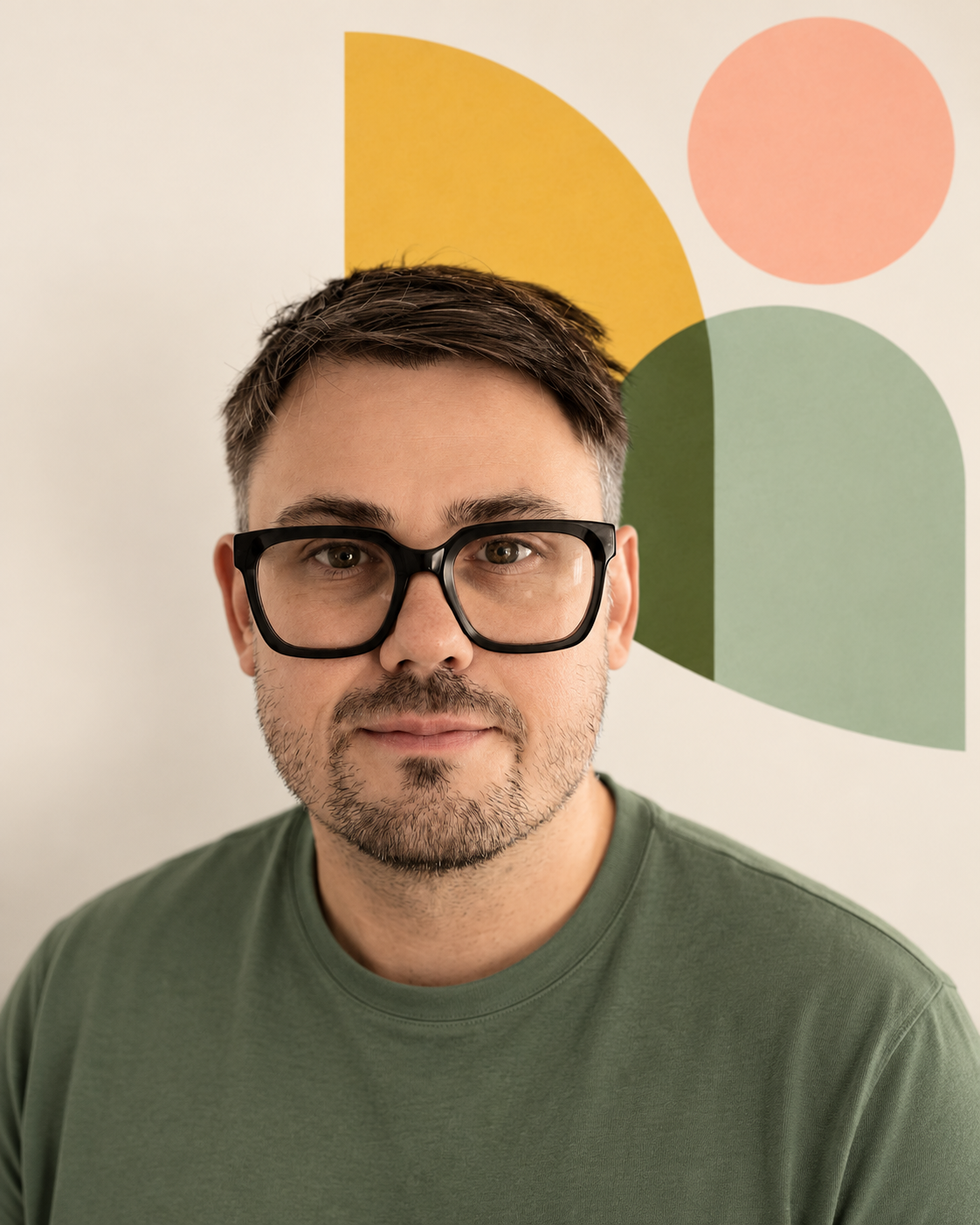 Dr Ben Marram in a sage green T-shirt, with the Field Guide Learning symbol behind him